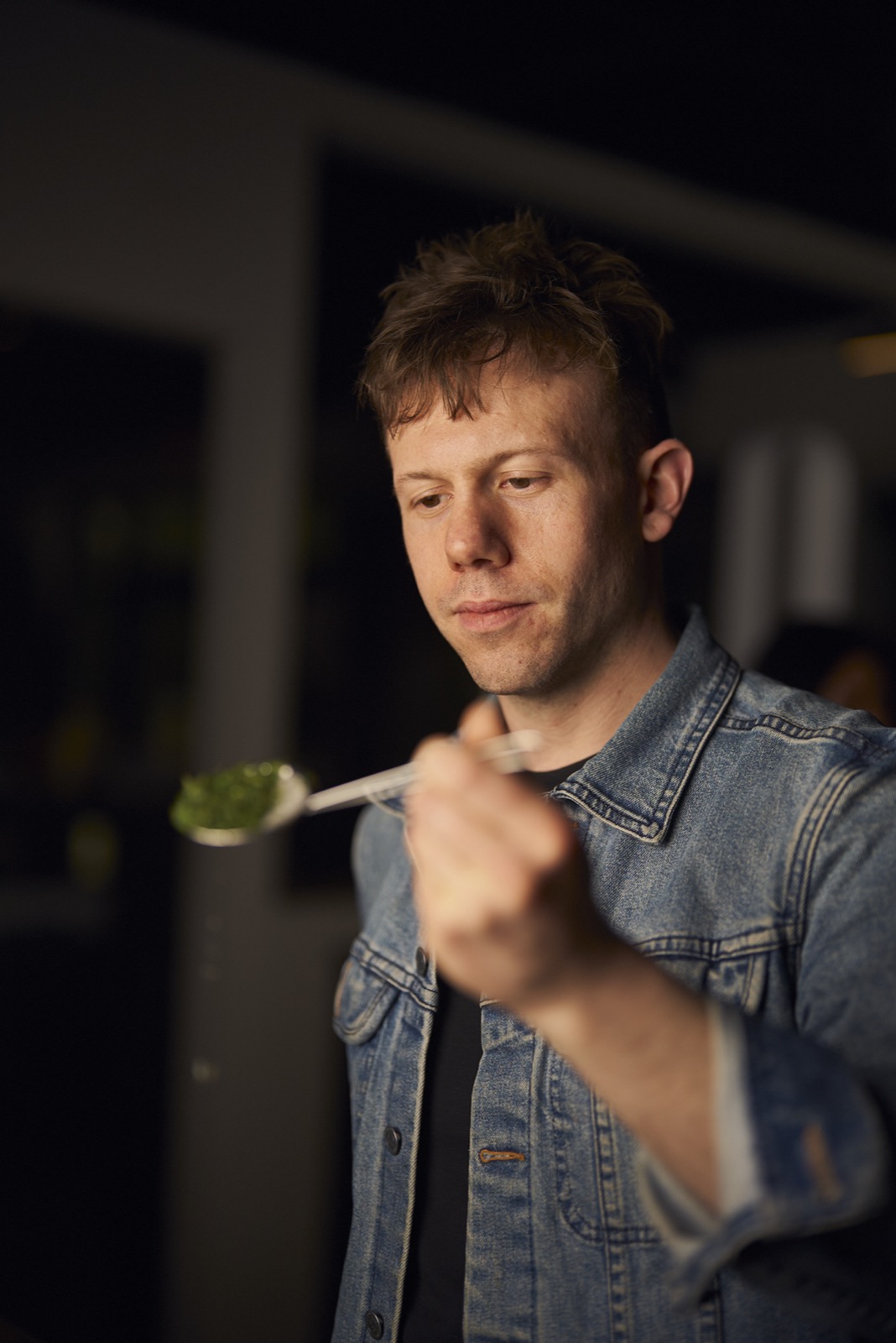 Marc Falzon inspects a spoonful of matcha at Ooika, April 2025. (Photo: Ooika)